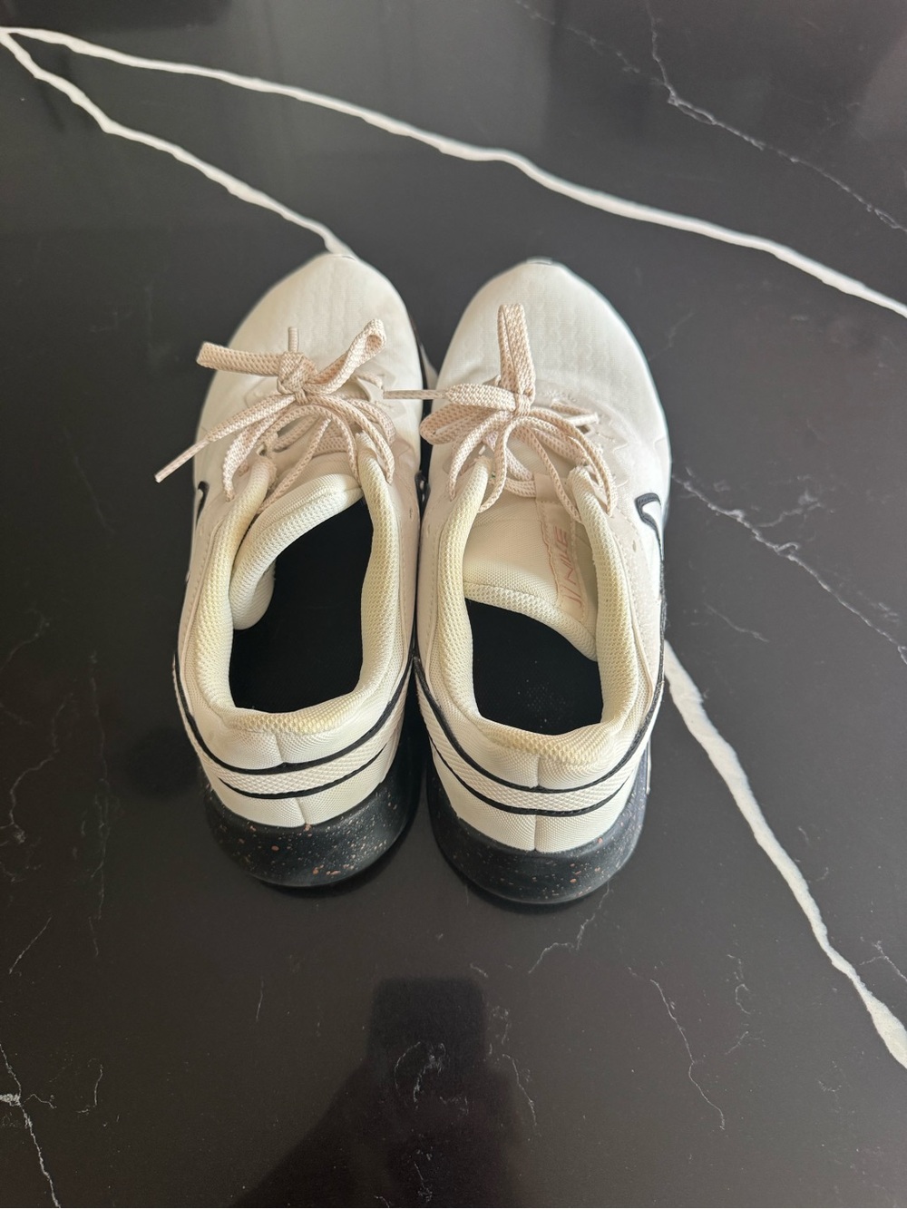 Nike light Cream Athletic Sneakers with Black Accents